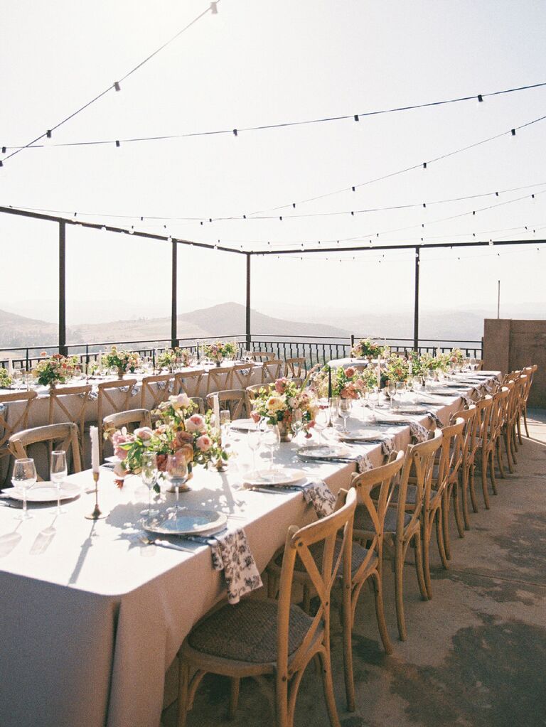 Long reception tables at outdoor wedding