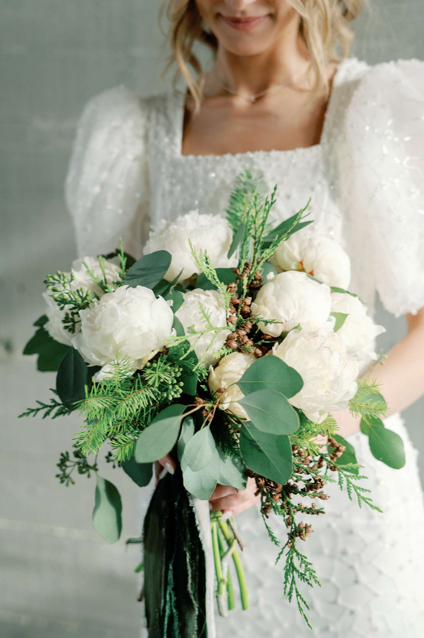 Bride's Bouquet With White Flowers, Small Berries, Pine Branches and  Greenery for Winter