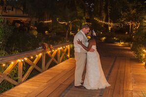 Newlywed Kiss Among Twinkle Lights