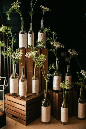 Wine-Themed Escort Card Display with Wine Bottle Seating Chart
