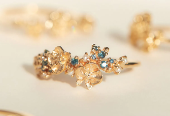 diamond cluster arranged in unique bouquet design and casted in gold