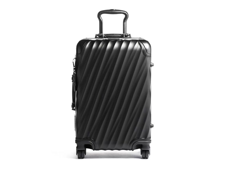 Textured black carry-on suitcase for newlyweds