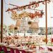 Burgundy Velvet Chairs and Assorted Chandeliers Uner Reception Tent