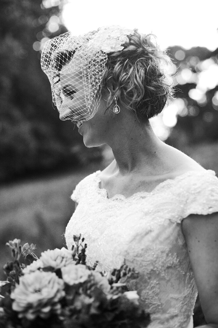 Kate accessorized with a fascinator veil on her wedding day. Her hair was styled by Jewel Hair Design. She also wore pearl drop earrings.