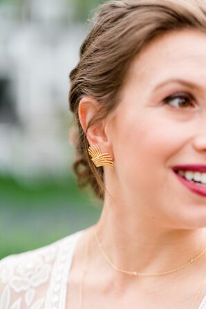 Bride Shows Off Updo and Gold Earrings