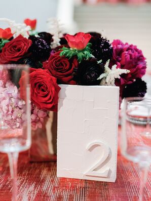 Modern White Table Number Beside Red Rose Centerpiece