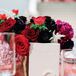Modern White Table Number Beside Red Rose Centerpiece