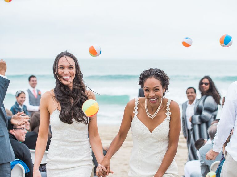 Brides have guests throw mini beach balls for the wedding exit toss. 