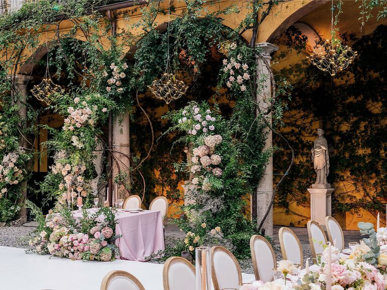 Sweetheart table backdrop at fairytale-themed wedding
