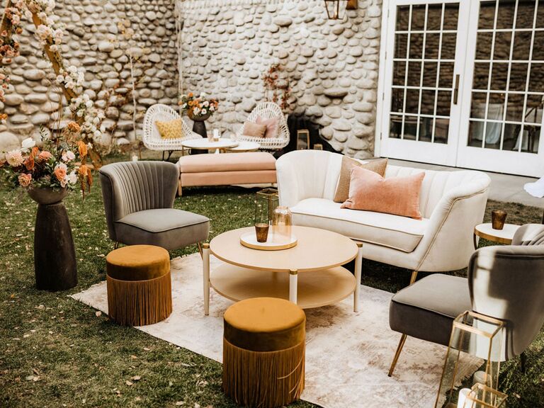 Boho mismatched lounge seating area at wedding reception