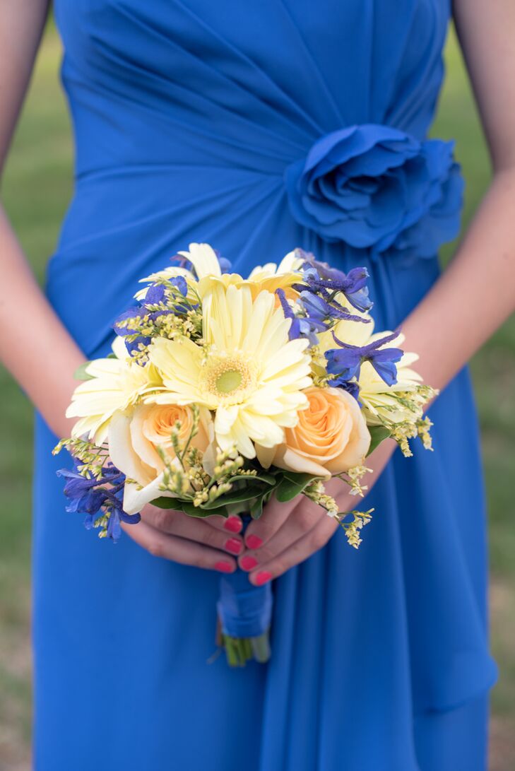 The couple went for an understated, summery aesthetic when it came to the flowers. For the ceremony, Katie and her bridesmaids carried fresh bunches of gerbera daisies, creme de la creme roses, delphiniums and calla lilies down the aisle in soft, cheerful shades of yellow, peach and blue.