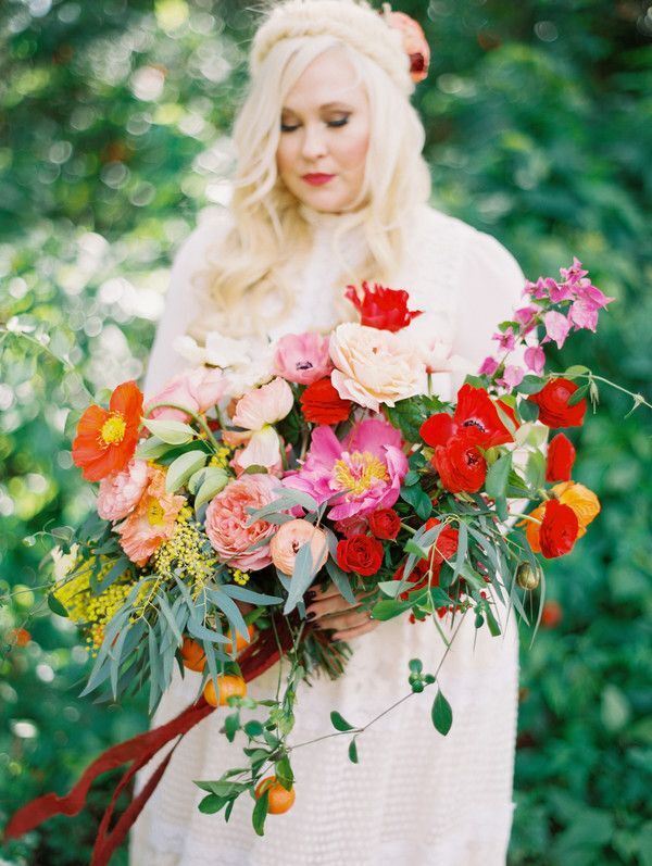 bride holding pink-and-red wedding bouquet