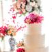 Elegant Tiered Wedding Cake with Pink Flowers