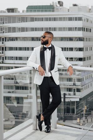 Dapper-Looking Groom in Black-and-White Tuxedo