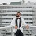 Dapper-Looking Groom in Black-and-White Tuxedo