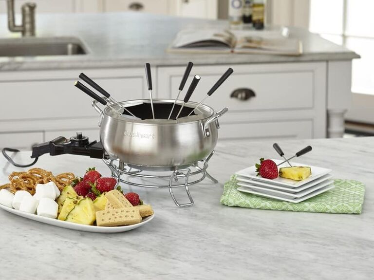 At-home fondue kit pictured with an array of sweet treats to dip in chocolate last-minute anniversary gift