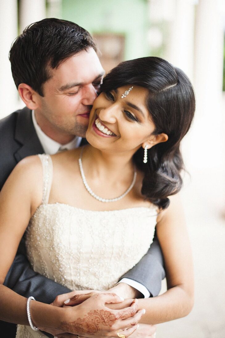 Indhu wore her hair down with smooth waves, and accented the classic style with a silver bindi.