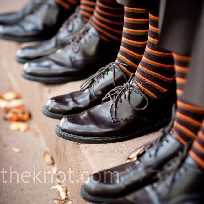 The groom and groomsmen wore matching brown-and-orange-striped socks.