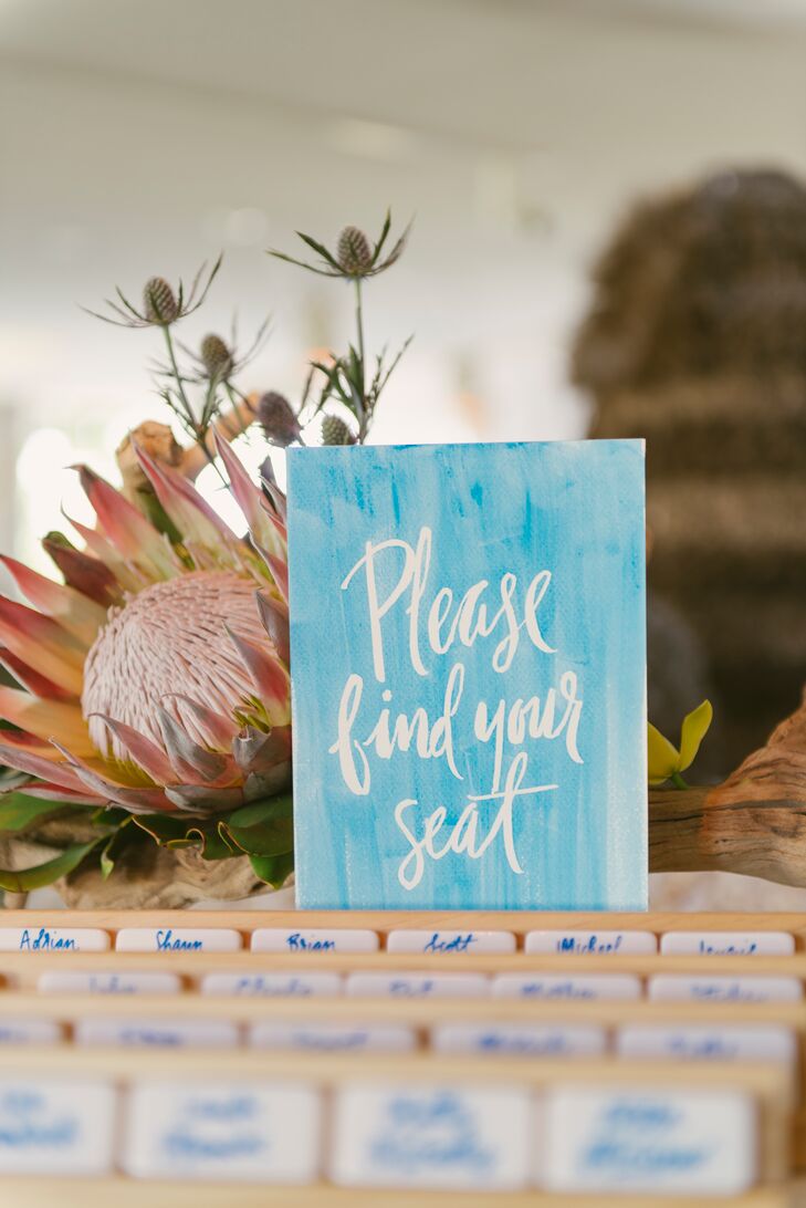 Calligrapher and illustrator Natalie Soud created Diana and Stephan's tropical-themed invitation suite and inscribed  domino tiles for escort cards. "I grew up playing dominoes with my mom and my grandfather, so Stephan and I continue that tradition and bring a box of dominoes on every trip we take," Diana says. "That’s why we had everyone’s name drawn on the back of a domino with the reverse side’s dots indicating their table number."