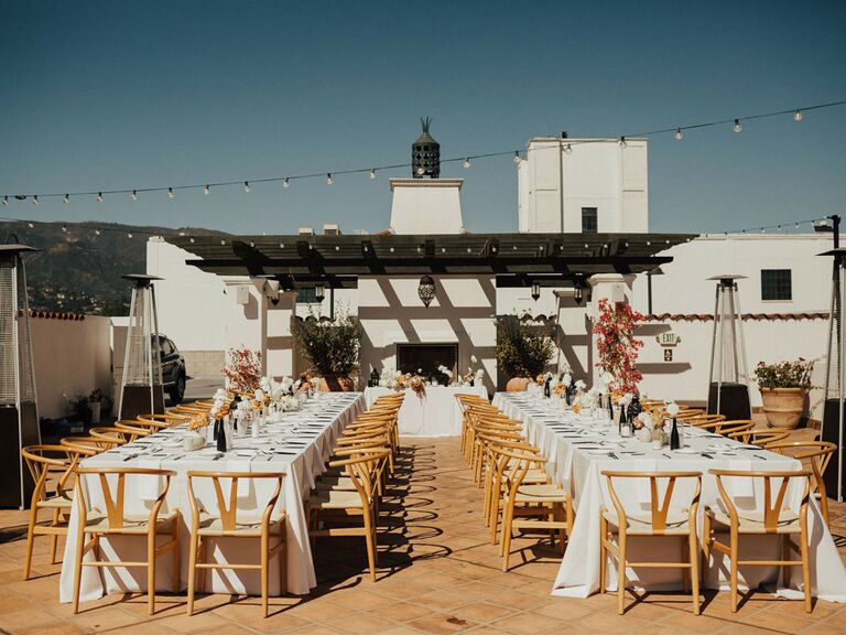 Summer rooftop wedding venue with string lights