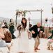 Bohemian Couple Dancing During Recessional