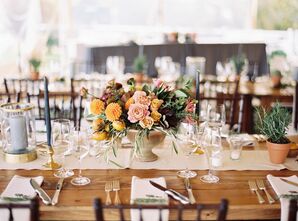 Wedding Reception Tables Topped with Centerpieces Filled with Garden Roses, Ranunculus, Dahlias and Scabiosa