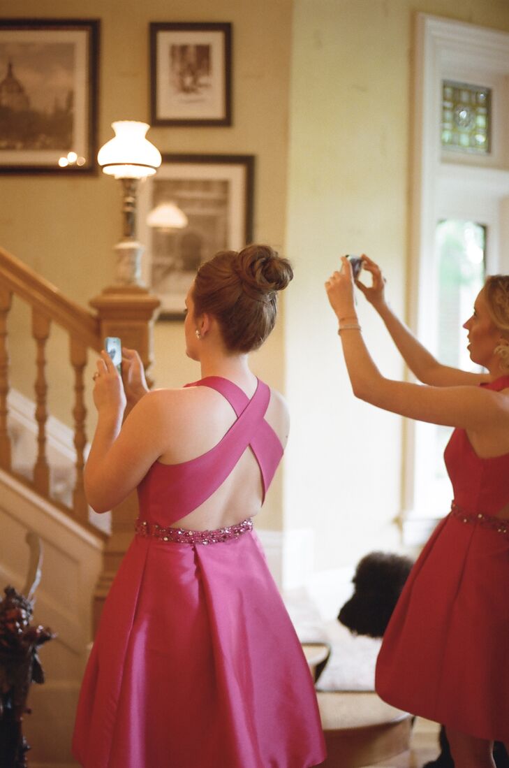 The bridesmaids captured Jennifer's entrance from the bottom of the stairs at the Saint Paul Hotel in St. Paul.