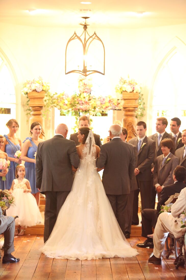 "We had a huge wooden cross covered in gorgeous flowers as the backdrop for our ceremony," says Tara. "I wanted our wedding to glorify Jesus and all he's done for us!"