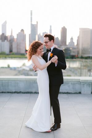 Modern Couple Wearing Simple Wedding Dress and Black Tuxedo