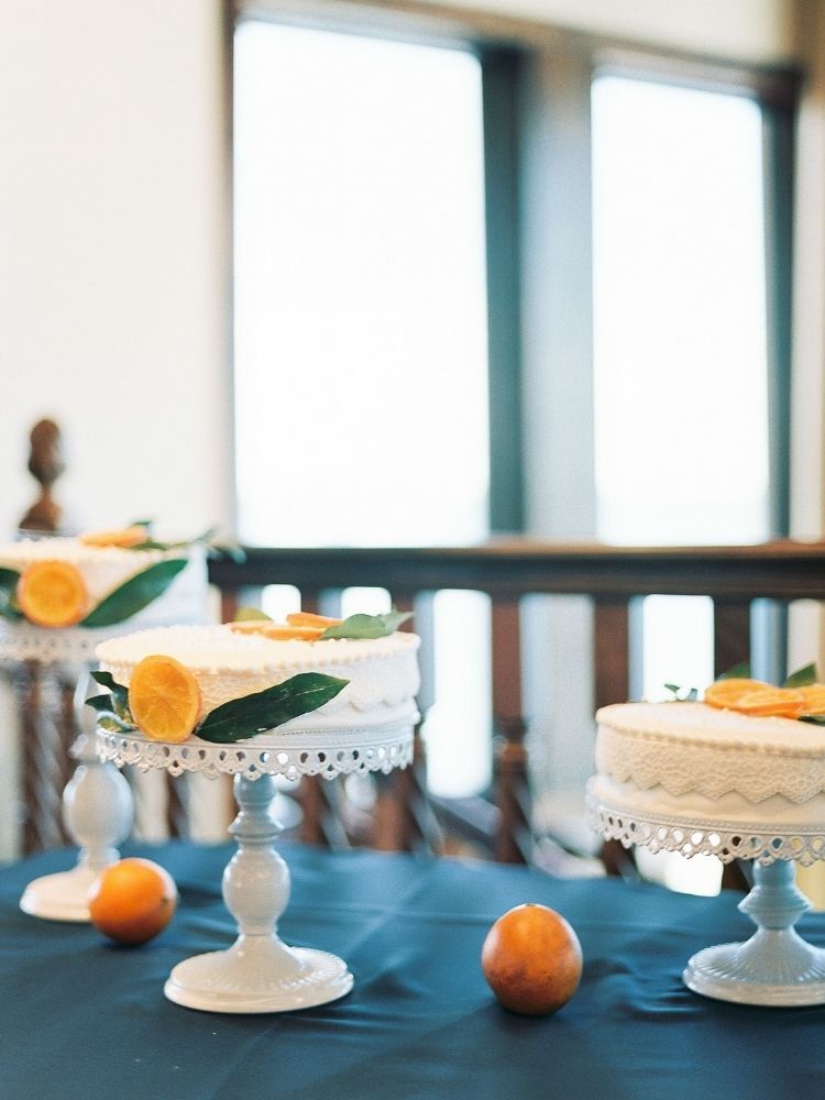 white wedding cakes decorated with oranges