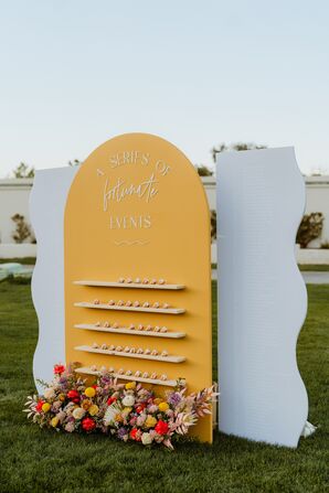 Yellow-and-White Escort Card Display With Retro Vibes and Fortune Cookies