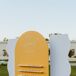 Yellow-and-White Escort Card Display With Retro Vibes and Fortune Cookies
