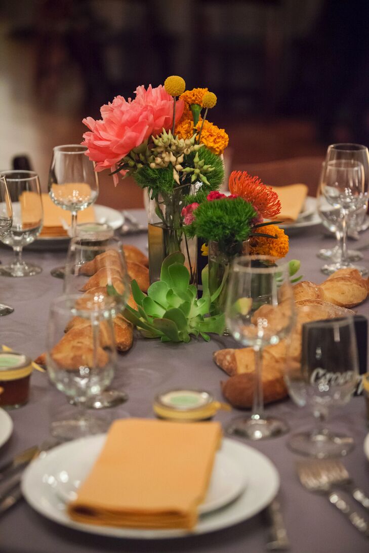 The bride and groom did not have a strict color palette for their wedding. They stuck to warm neutrals and fall colors, like burnt orange, purple and yellow.  The bride requested a mixture of textures and native flowers like succulents.