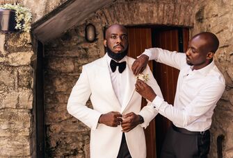 A groom and his best man prepare for the big day.