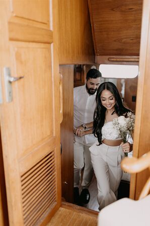 Bride and Groom in Casual White Clothes, on Boat, Pre-Wedding Event, Small Bouquet