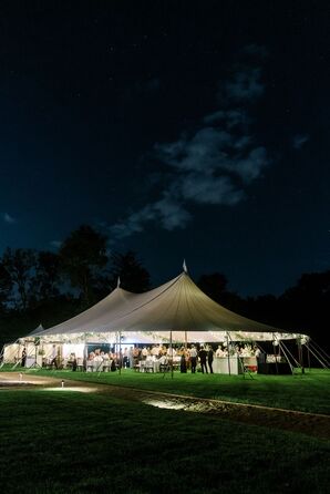 Tented Reception on Estate Lawn With String Lighting at Night