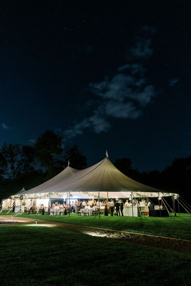 Tented Reception on Estate Lawn With String Lighting at Night