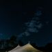 Tented Reception on Estate Lawn With String Lighting at Night