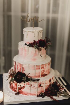A Blush and Burgundy Watercolor Cake with a Topper and Dahlias