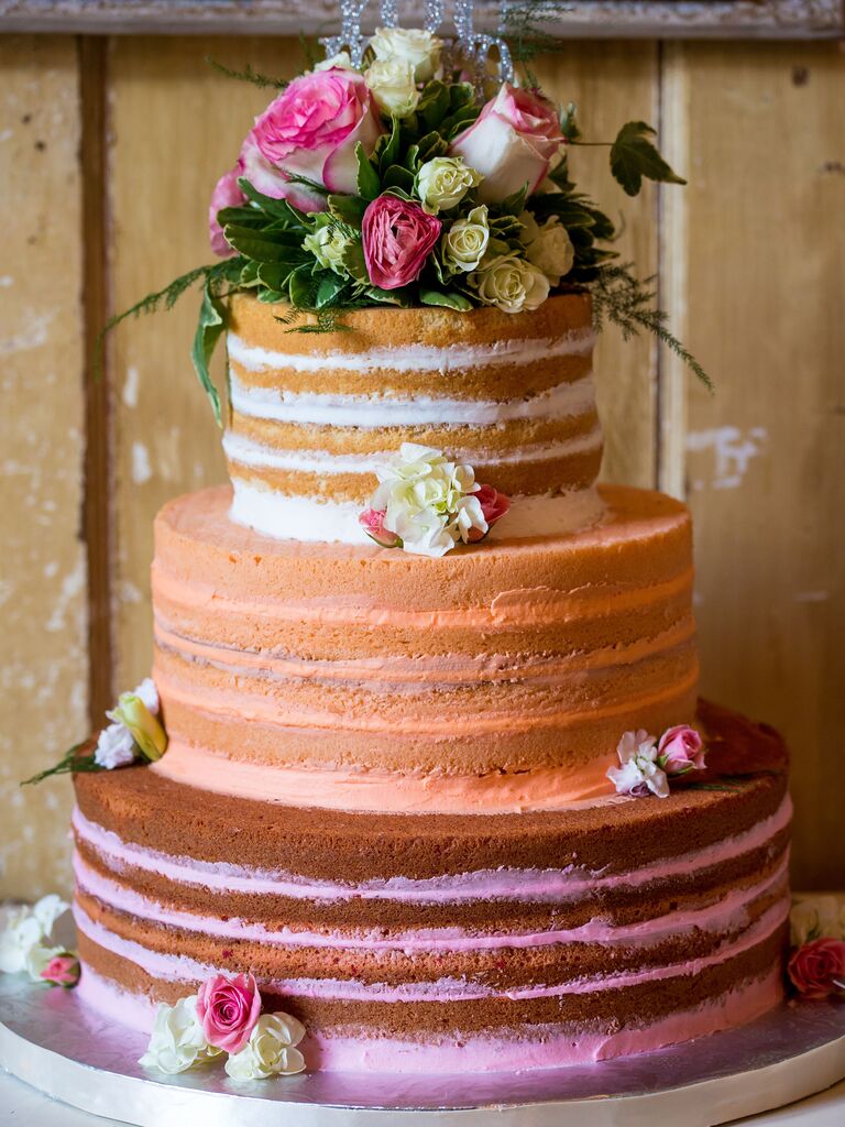 three tier naked wedding cake with ombre white, orange and pink filling