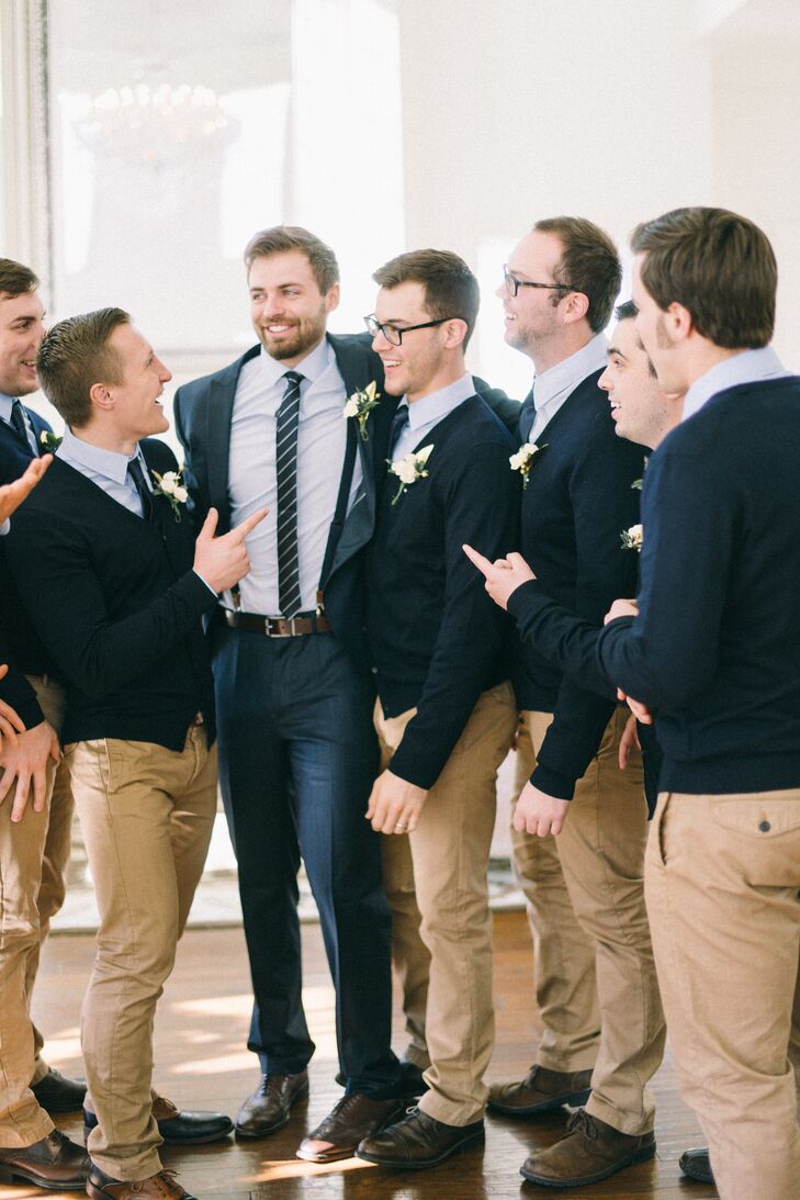 “We wanted to select an outfit that was not only affordable, but an outfit they could wear again,” says Elena. The groomsmen wore navy blue cardigans and bowties, light blue dress shirts, and khaki pants.