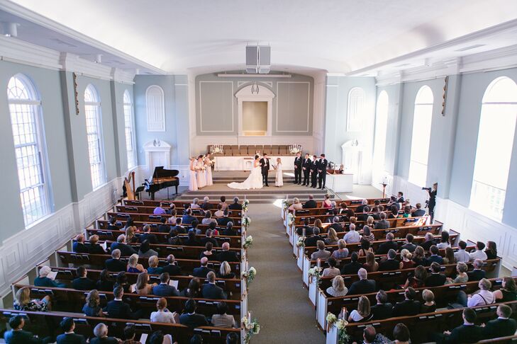 Christine and Keith had their ceremony at the Prairie Baptist Church in Prairie Village, Kansas. “It has the most amazing windows throughout the sanctuary,” Christine says. “Right before the wedding ceremony began, to the sound of ‘Ode to Joy’ on the harp, the windows simultaneously opened to allow a flood of glorious light into the room.”