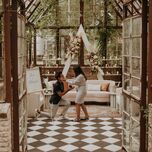 couple getting engaged in a beautiful indoor garden