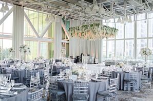 Lucite Chiavari Chairs with Blue Tablecloths Under Hanging Hydrangea Installation