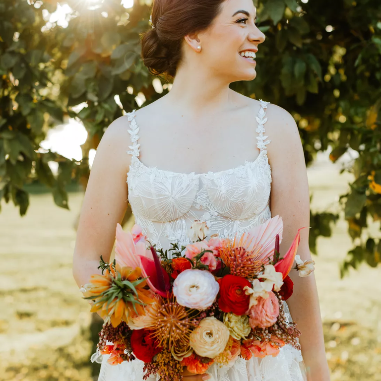 Autumn wedding bouquet in red, orange and peach