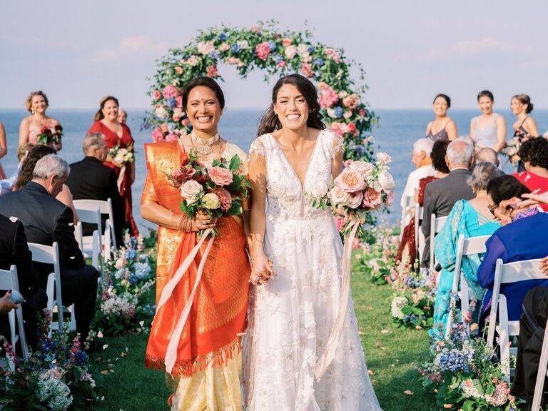 brides holding hands during ceremony recessional