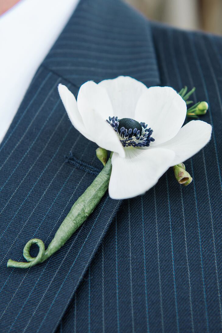 The groom wore a simple white anemone boutonniere.
