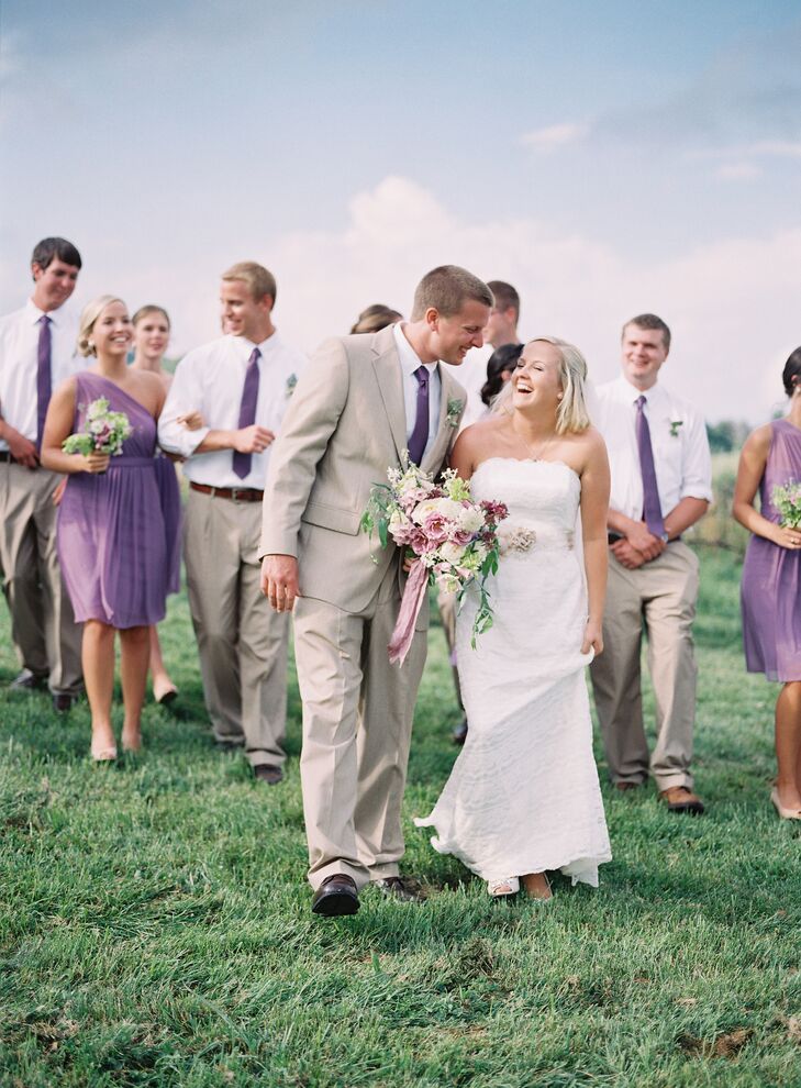 The groomsmen wore tan suit pants, white button-down shirts and wisteria ties that matched the bridesmaids' purple dresses.