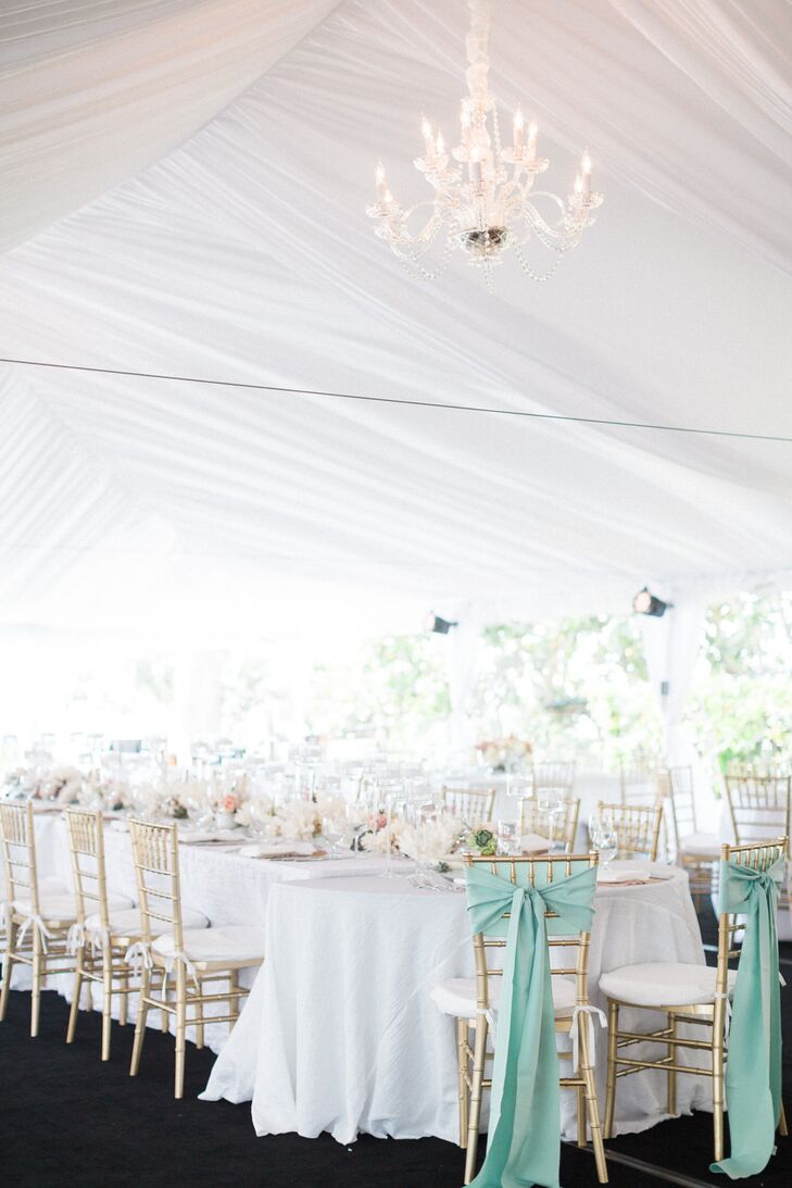 Of course, they also brought Stephanie’s favorite color into the reception. The newlyweds' gold chiavari chairs were wrapped in mint sashes and stood out at the head of their wedding party’s table.
