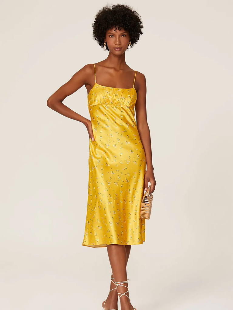 A model shows off this spaghetti strap floral gown.